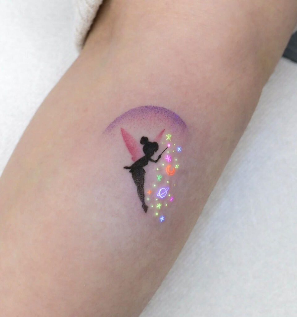UV ink cats and mushroom tattoo located on the inner